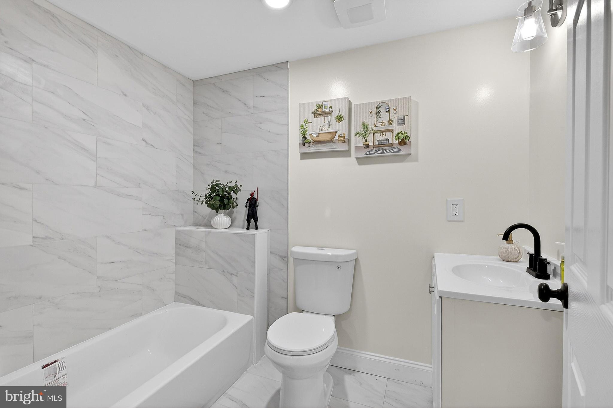 4 Lower Greenbriar Road Wilmington, DE 19810 - Photo 11 of 31 a bathroom with a toilet sink and tub