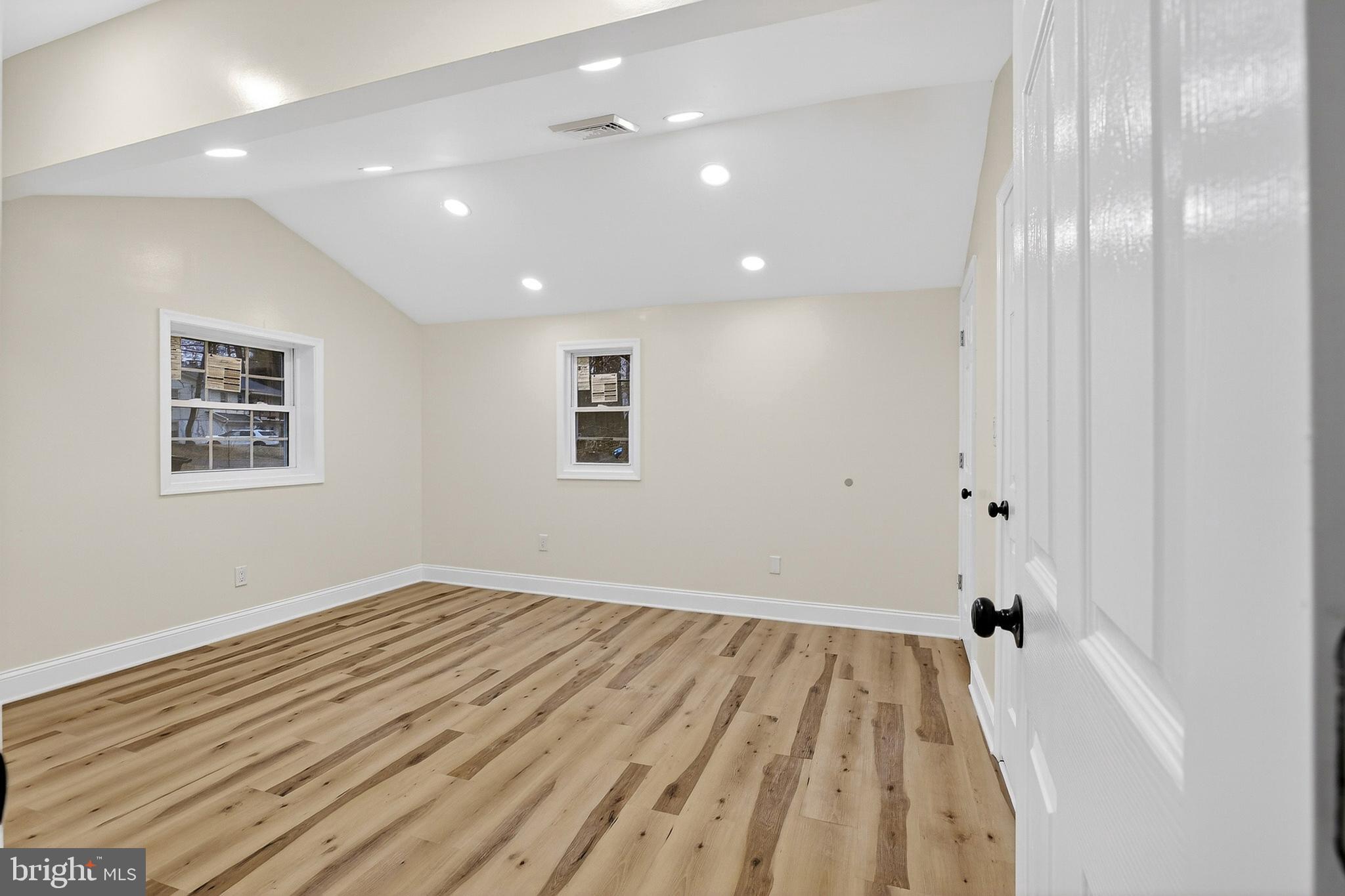 4 Lower Greenbriar Road Wilmington, DE 19810 - Photo 14 of 31 wooden floor in an empty room with a window