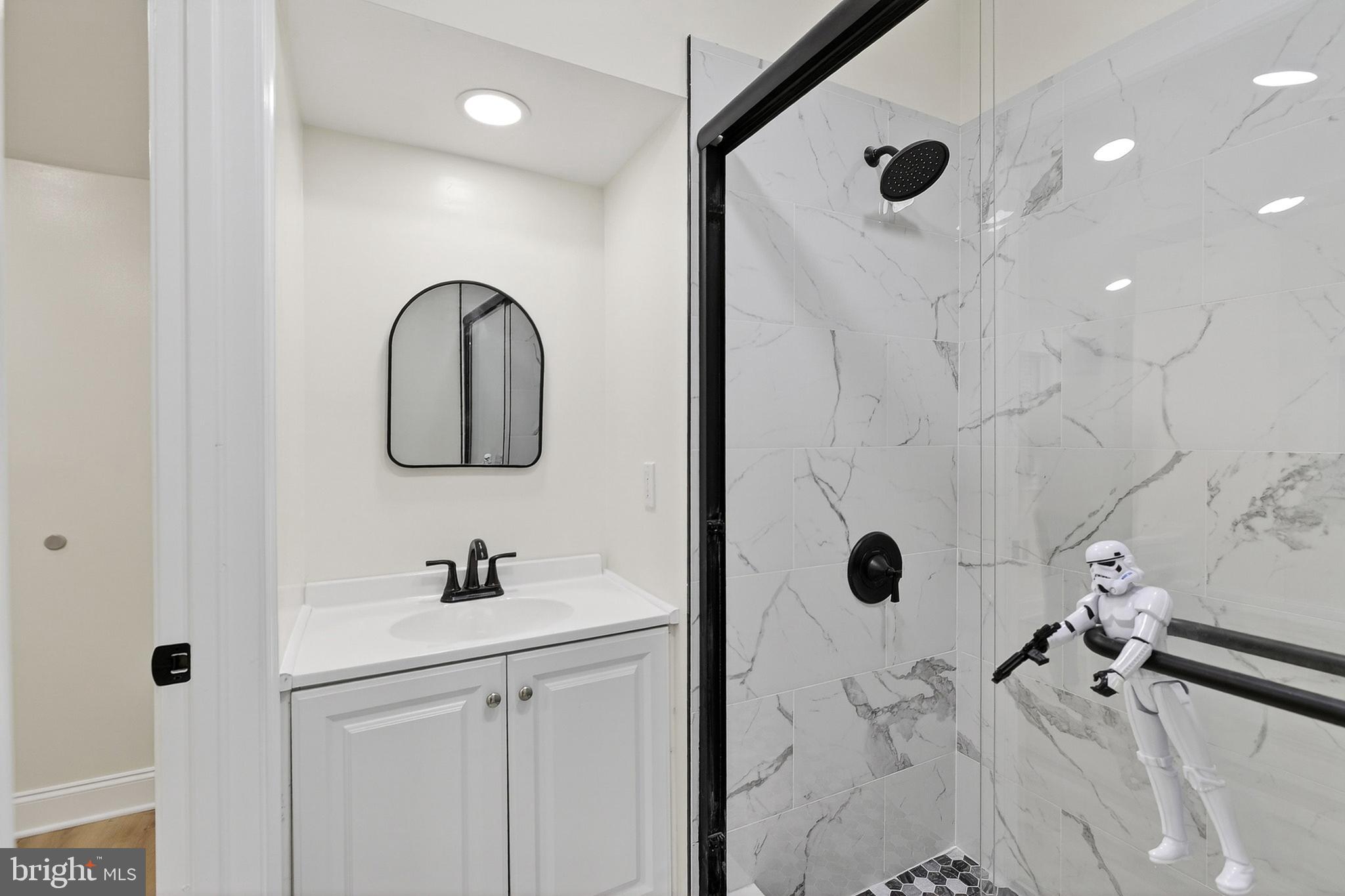 4 Lower Greenbriar Road Wilmington, DE 19810 - Photo 16 of 31 a bathroom with a sink toilet and shower