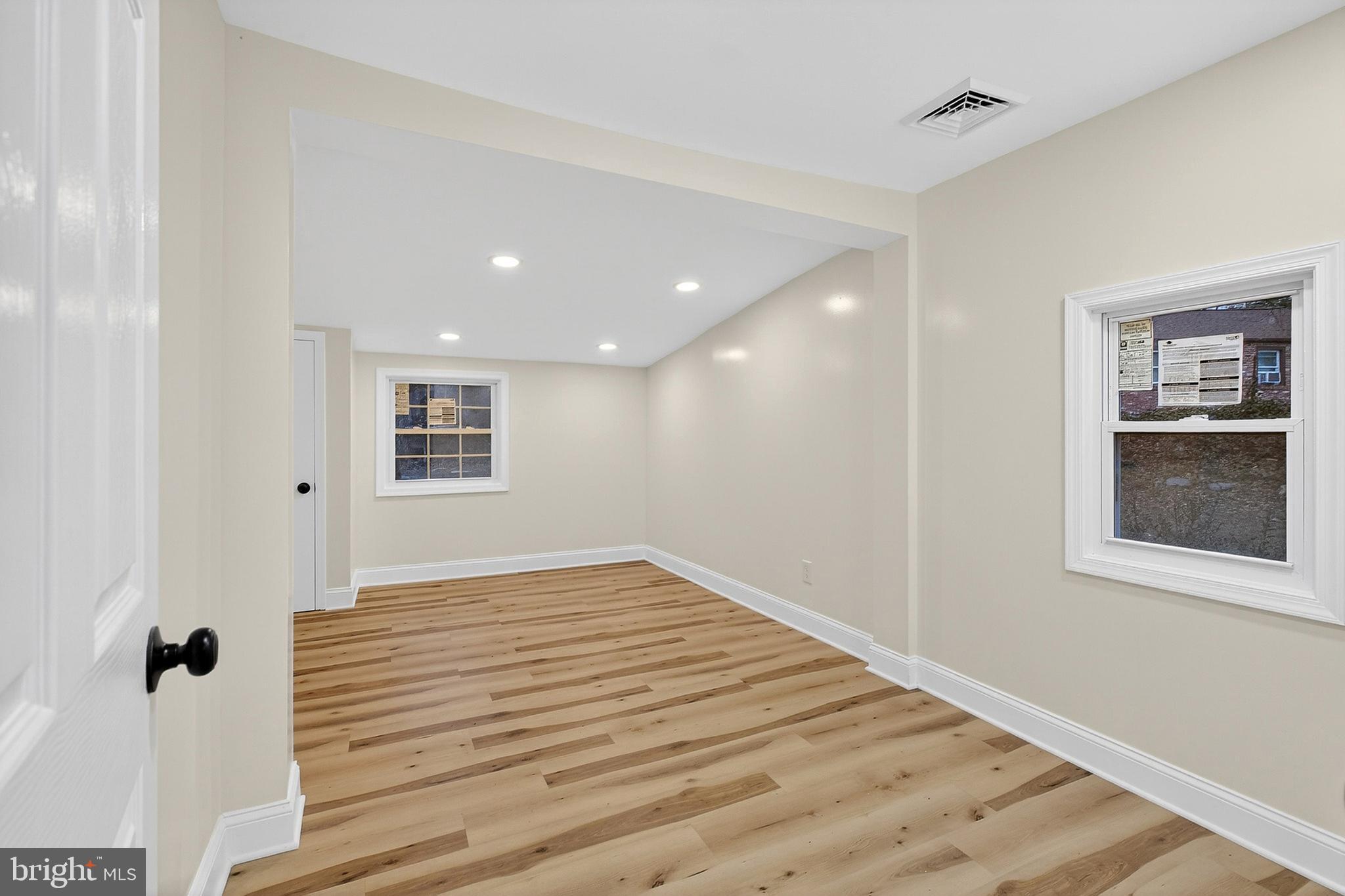 4 Lower Greenbriar Road Wilmington, DE 19810 - Photo 17 of 31 a view of a hallway with wooden floor and a cabinet