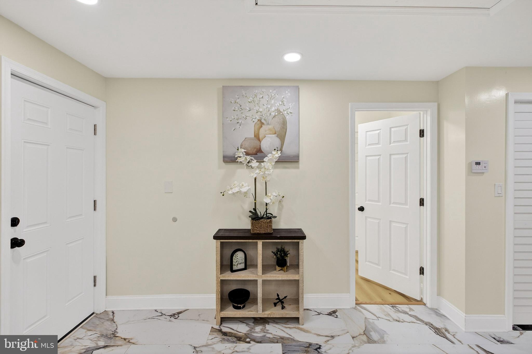 4 Lower Greenbriar Road Wilmington, DE 19810 - Photo 20 of 31 a view of a hallway with wooden floor