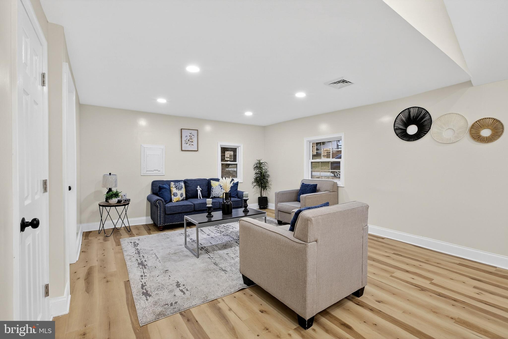 4 Lower Greenbriar Road Wilmington, DE 19810 - Photo 2 of 31 a living room with furniture and a wooden floor