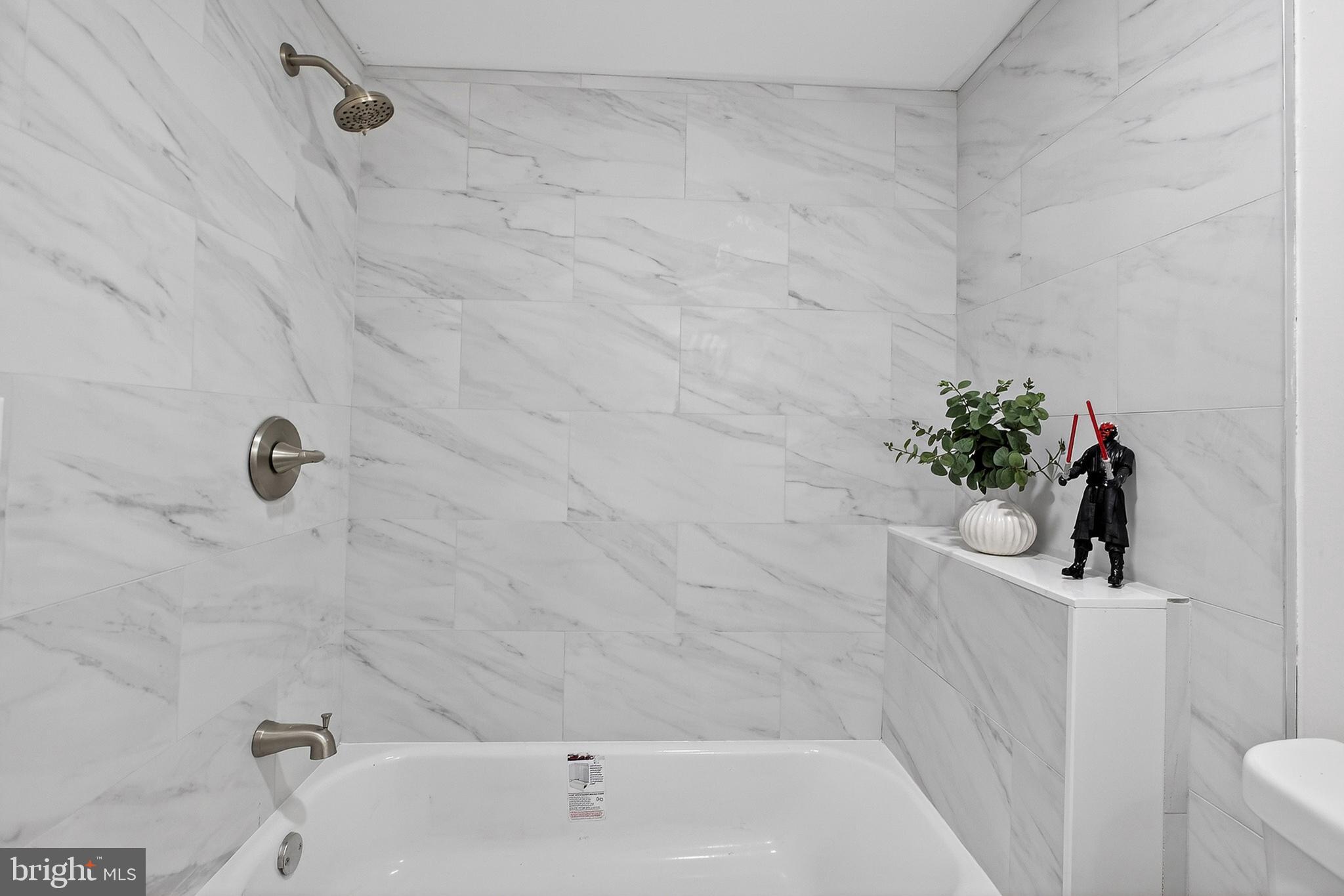 4 Lower Greenbriar Road Wilmington, DE 19810 - Photo 25 of 31 a bath tub sitting next to a white sink