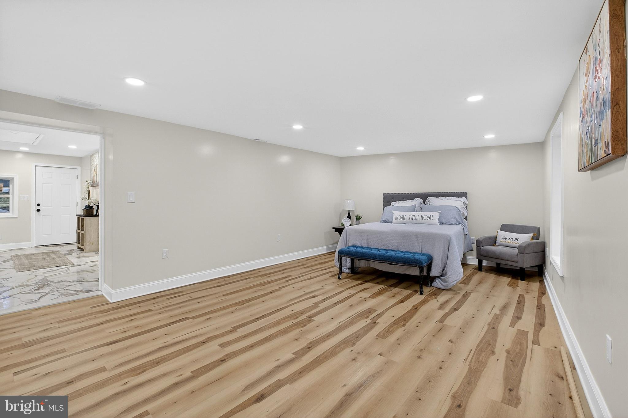 4 Lower Greenbriar Road Wilmington, DE 19810 - Photo 26 of 31 a living room with furniture and a wooden floor
