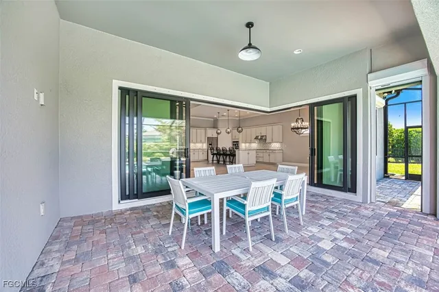 a bathroom with a granite countertop sink a toilet a mirror and shower