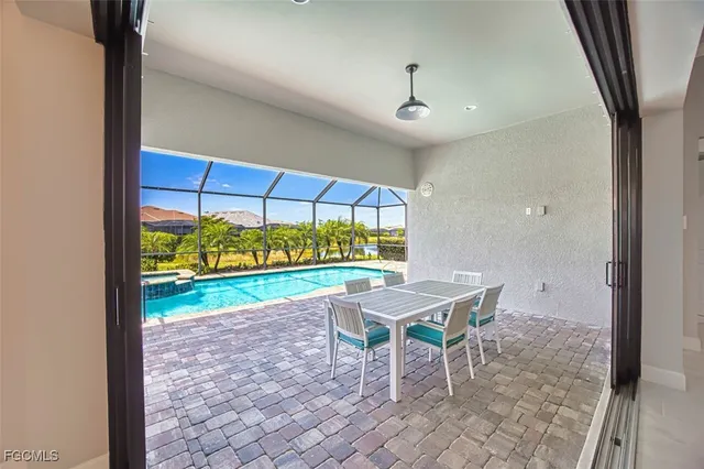 a bathroom with a granite countertop sink toilet a mirror a vanity and shower