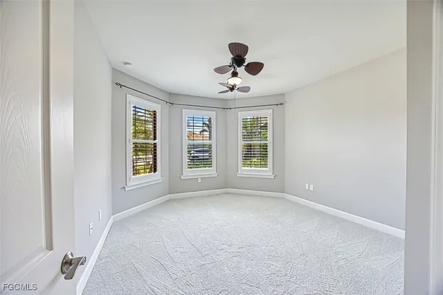 a view of a dining room with furniture large windows and wooden floor