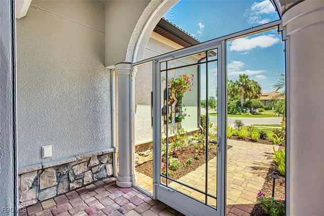 a large kitchen with a table and chairs