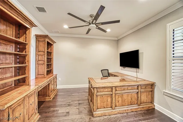 a large kitchen with kitchen island granite countertop a sink a counter space appliances and cabinets