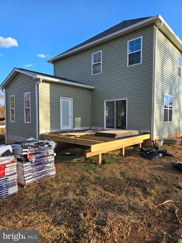 a view of a house with swimming pool and porch