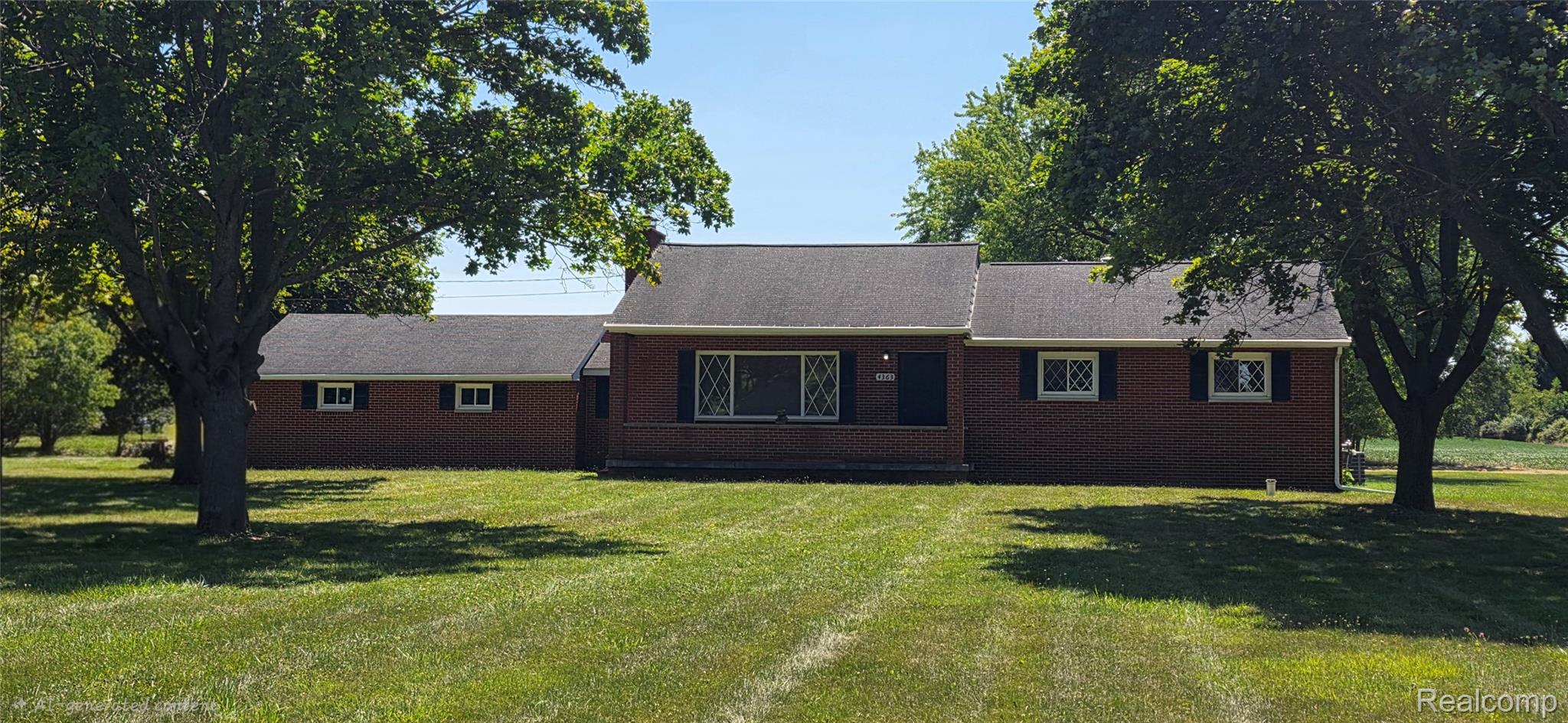 4363 West Dodge Road Clio, MI 48420 - Photo 52 of 52 Brick exterior residence featuring a covered front porch and a dark shingle roof