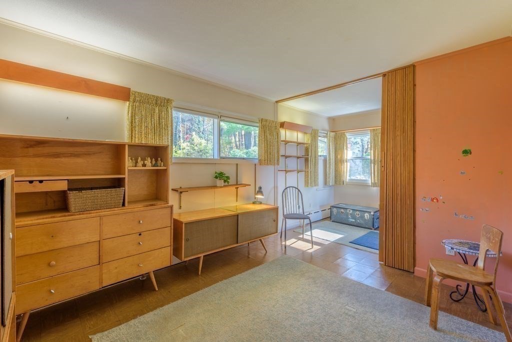 41 Arnold Road Pelham, MA 01002 - Photo 19 of 42 a bed room with a bed and a chair