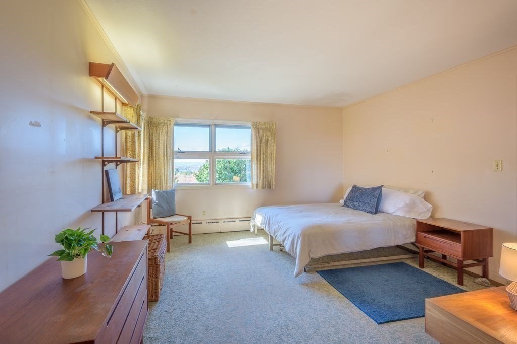 41 Arnold Road Pelham, MA 01002 - Photo 22 of 42 a bedroom with bed couch and window