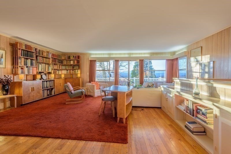 41 Arnold Road Pelham, MA 01002 - Photo 36 of 42 a large living room with a large window and furniture