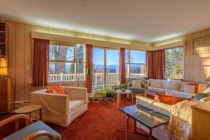 41 Arnold Road Pelham, MA 01002 - Photo 37 of 42 a living room with furniture and a large window