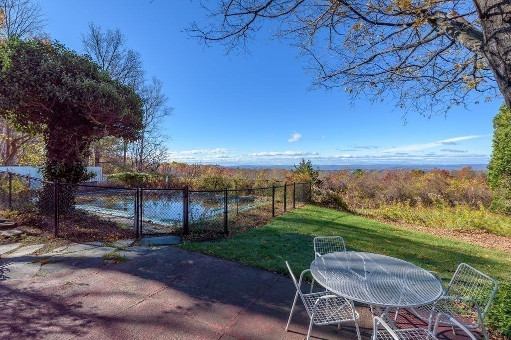 41 Arnold Road Pelham, MA 01002 - Photo 7 of 42 a view of a garden with furniture