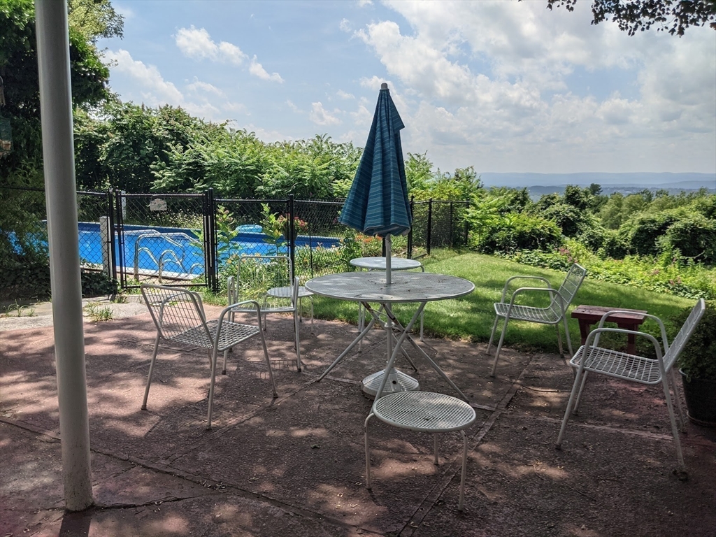 41 Arnold Road Pelham, MA 01002 - Photo 8 of 42 a view of a backyard with sitting area