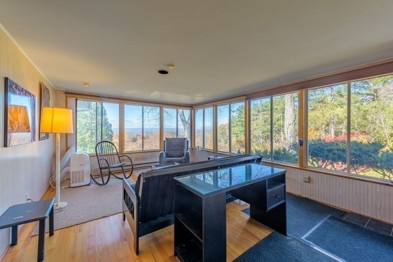 41 Arnold Road Pelham, MA 01002 - Photo 10 of 42 a bedroom with furniture and large windows