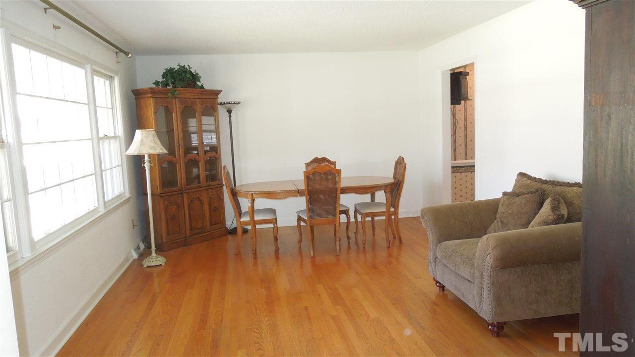 4901 Winterlochen Road Raleigh, NC 27603 - Photo 4 of 25 a dining room with furniture and wooden floor