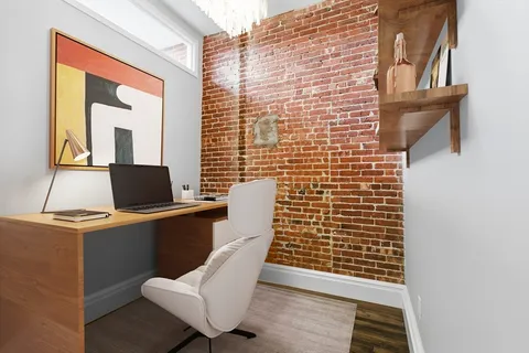 a view of workspace with wooden floor