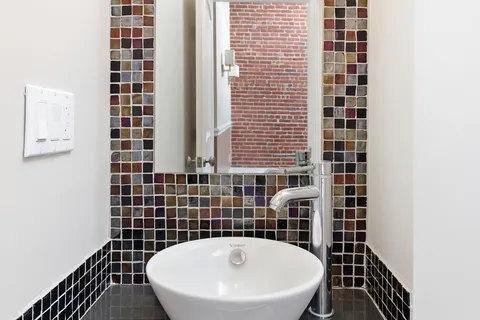 a bathroom with a toilet and a sink