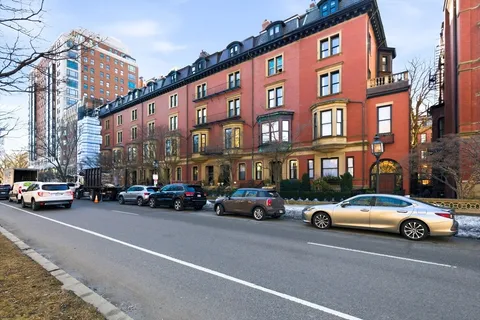 a view of a cars parked in front of a building