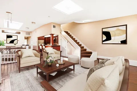 a living room with furniture and white walls