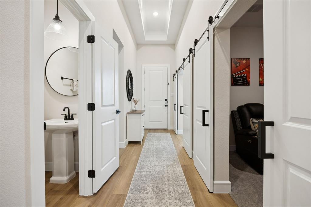 1415 Potenza Road Fate, TX 75087 - Photo 13 of 29 a view of a hallway with wooden floor and entryway