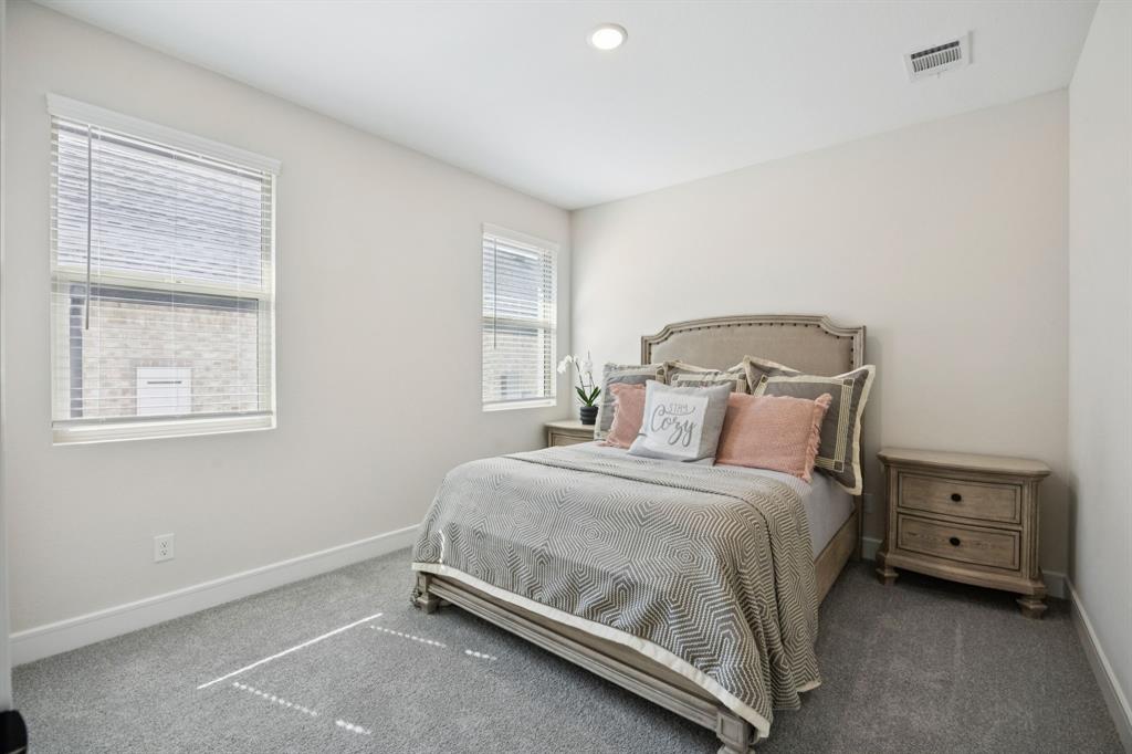 1415 Potenza Road Fate, TX 75087 - Photo 16 of 29 a bedroom with a bed and a window