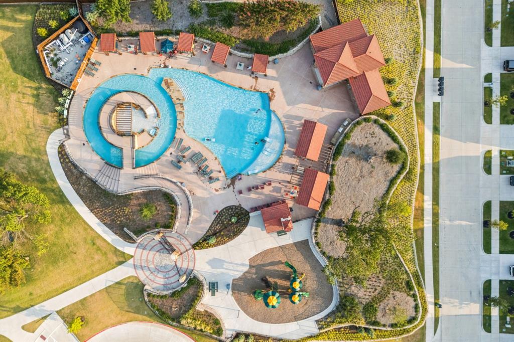 1415 Potenza Road Fate, TX 75087 - Photo 26 of 29 aerial view of a fireplace and table in a patio