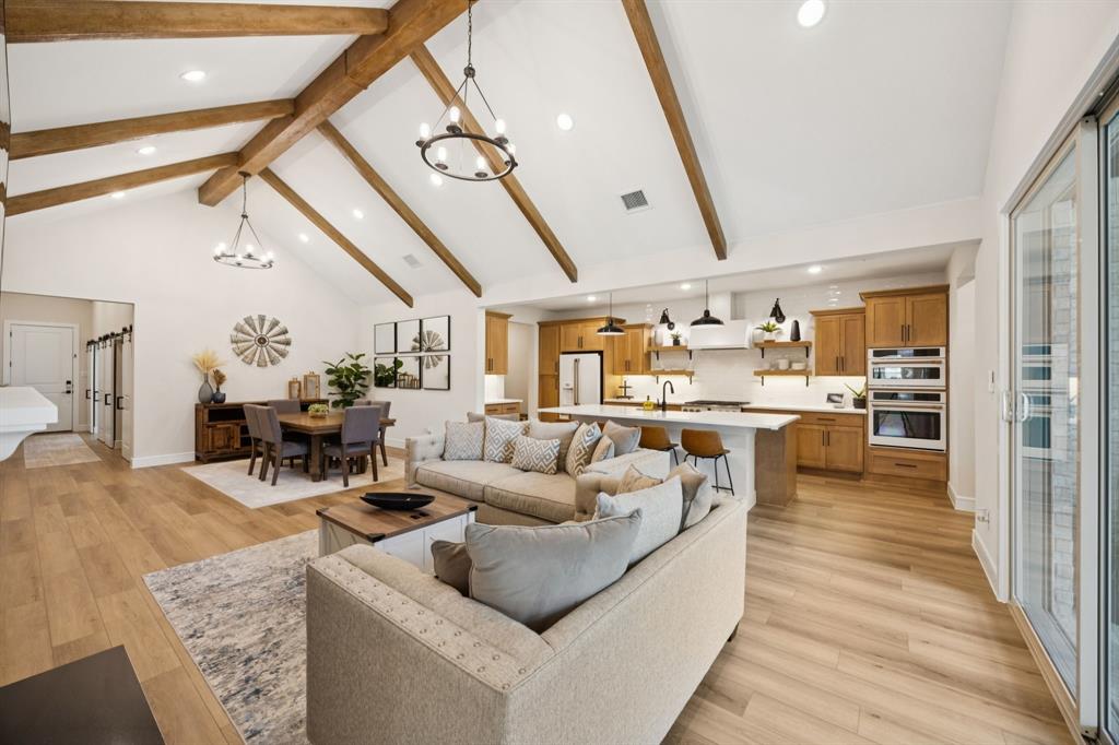 1415 Potenza Road Fate, TX 75087 - Photo 4 of 29 a living room with furniture and kitchen view