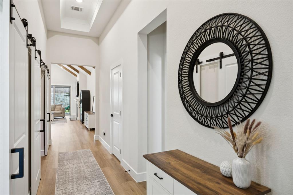 1415 Potenza Road Fate, TX 75087 - Photo 6 of 29 a view of a hallway with wooden floor