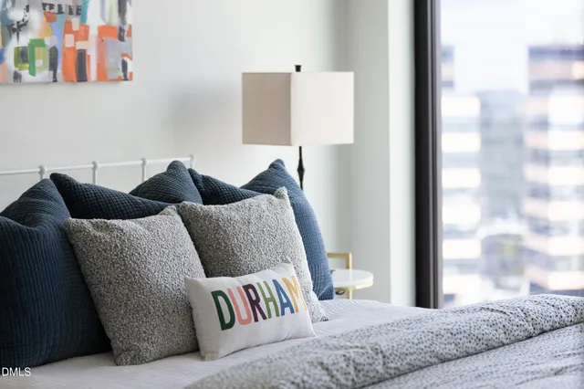 a view of a roof deck with furniture