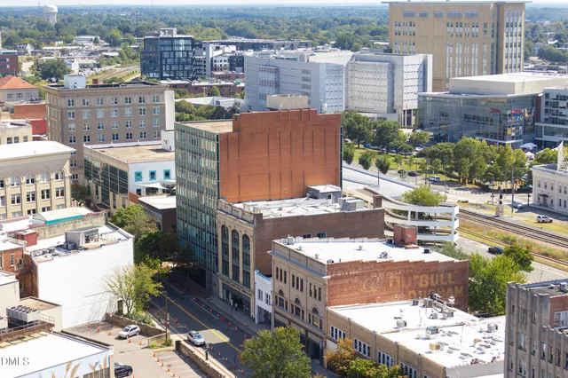 a view of a livingroom with furniture and a window