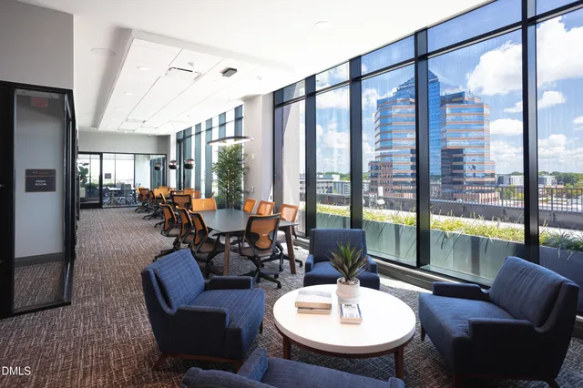 a picture of a bathroom with a shower and a painting on the wall