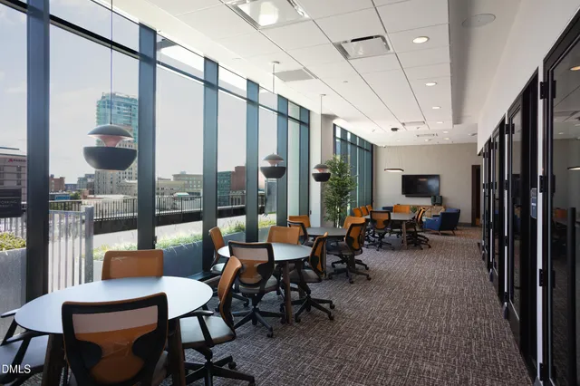 a view of a swimming pool with outdoor seating