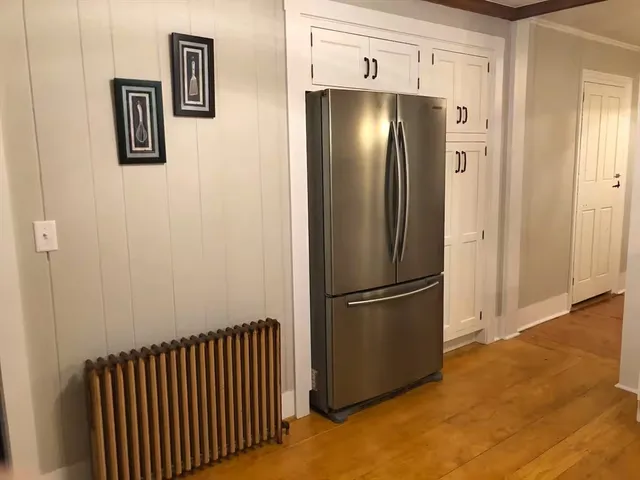 a view of a refrigerator in a kitchen