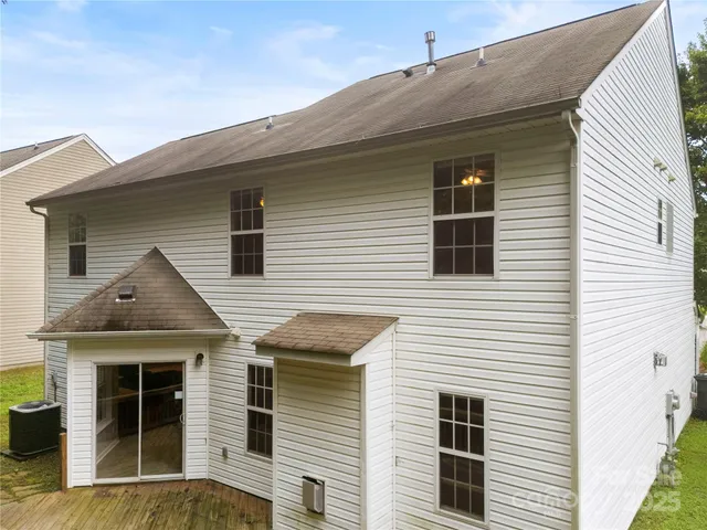 a view of a house with a window and balcony
