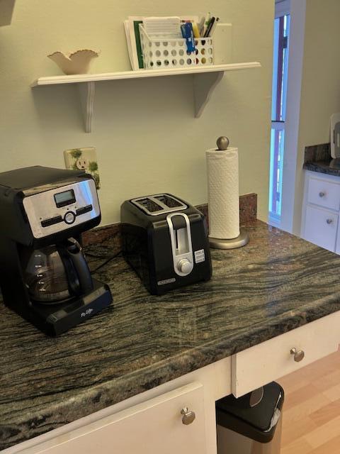 1955 Southwest Palm City Road, Unit H Stuart, FL 34994 - Photo 6 of 22 a room with a cabinet