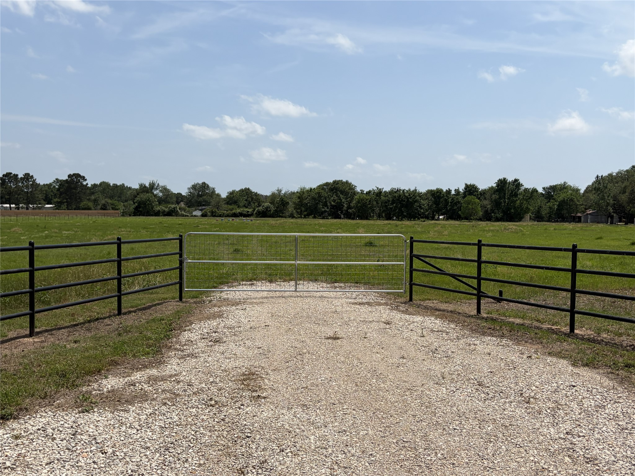 38785 Wiggins Road Hempstead, TX 77445 - Photo 20 of 28 a view of park with wooden fence and trees