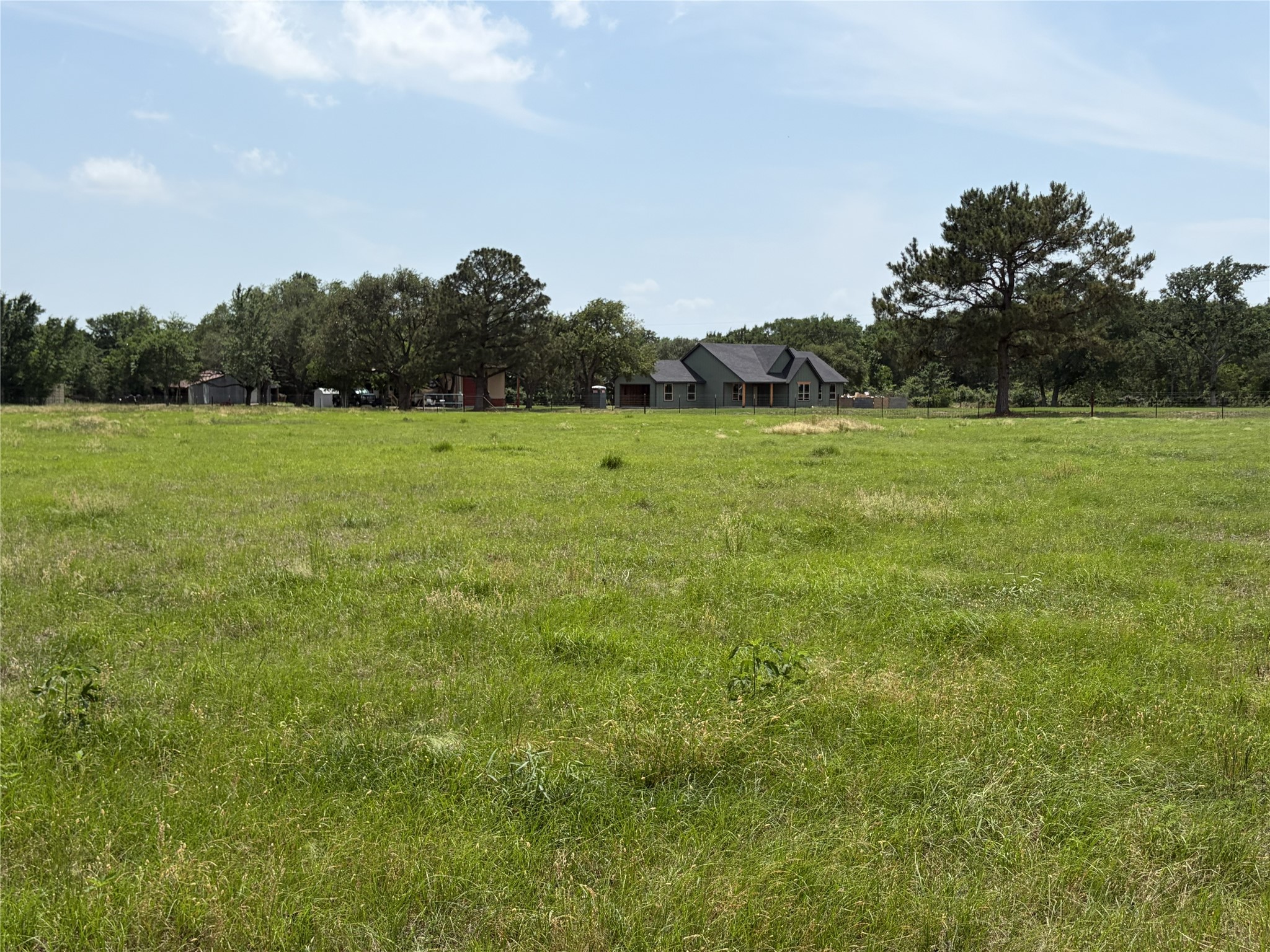 38785 Wiggins Road Hempstead, TX 77445 - Photo 22 of 28 a view of field with trees in the background