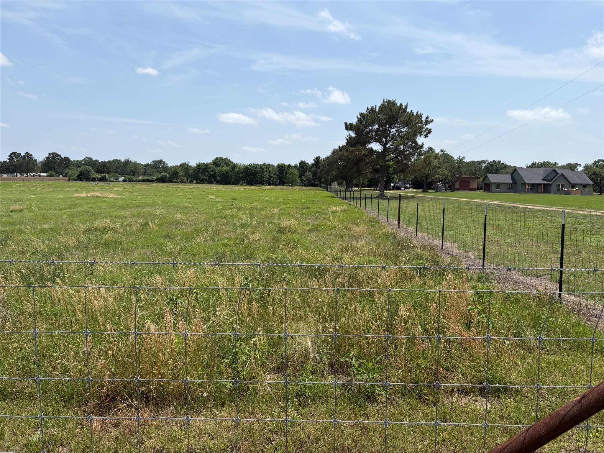 38785 Wiggins Road Hempstead, TX 77445 - Photo 28 of 28 a view of a lake from a yard