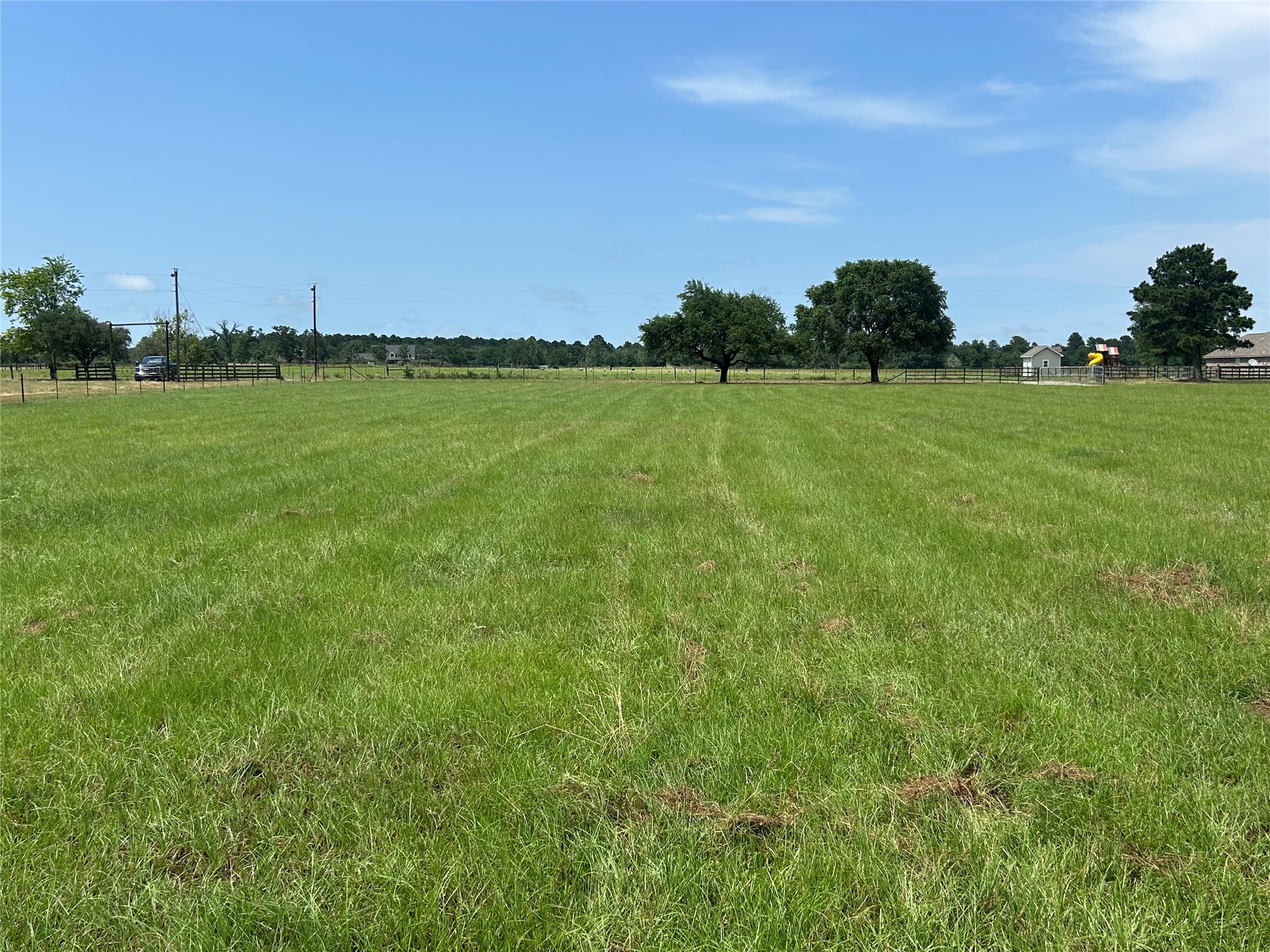 38785 Wiggins Road Hempstead, TX 77445 - Photo 3 of 28 a view of a golf course with a lake