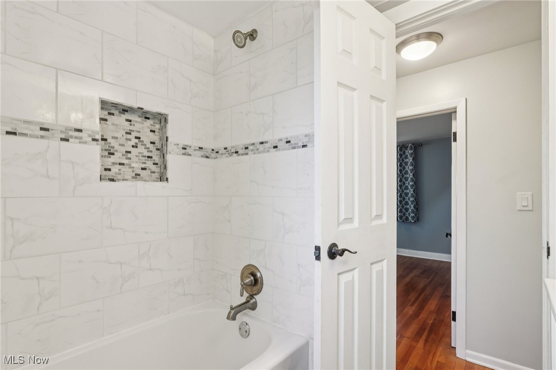 1151 Croyden Road Lyndhurst, OH 44124 - Photo 25 of 37 Bathroom featuring tub / shower combination and dark wood-style floors