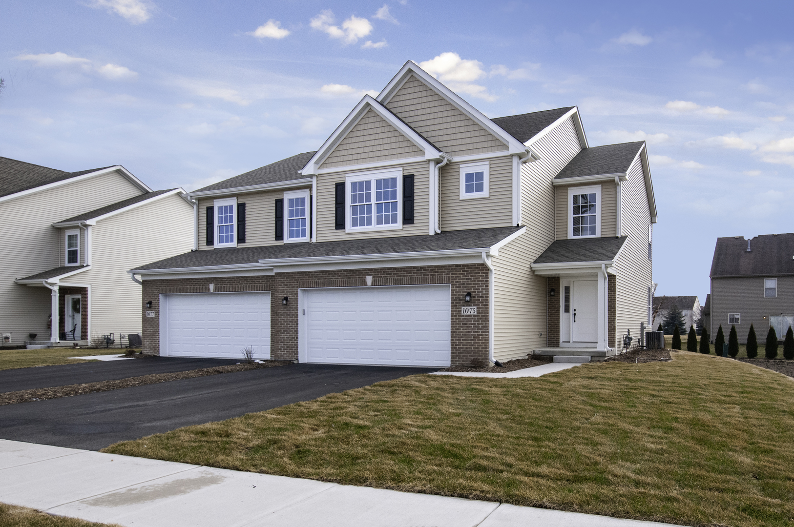 a front view of a house with a yard