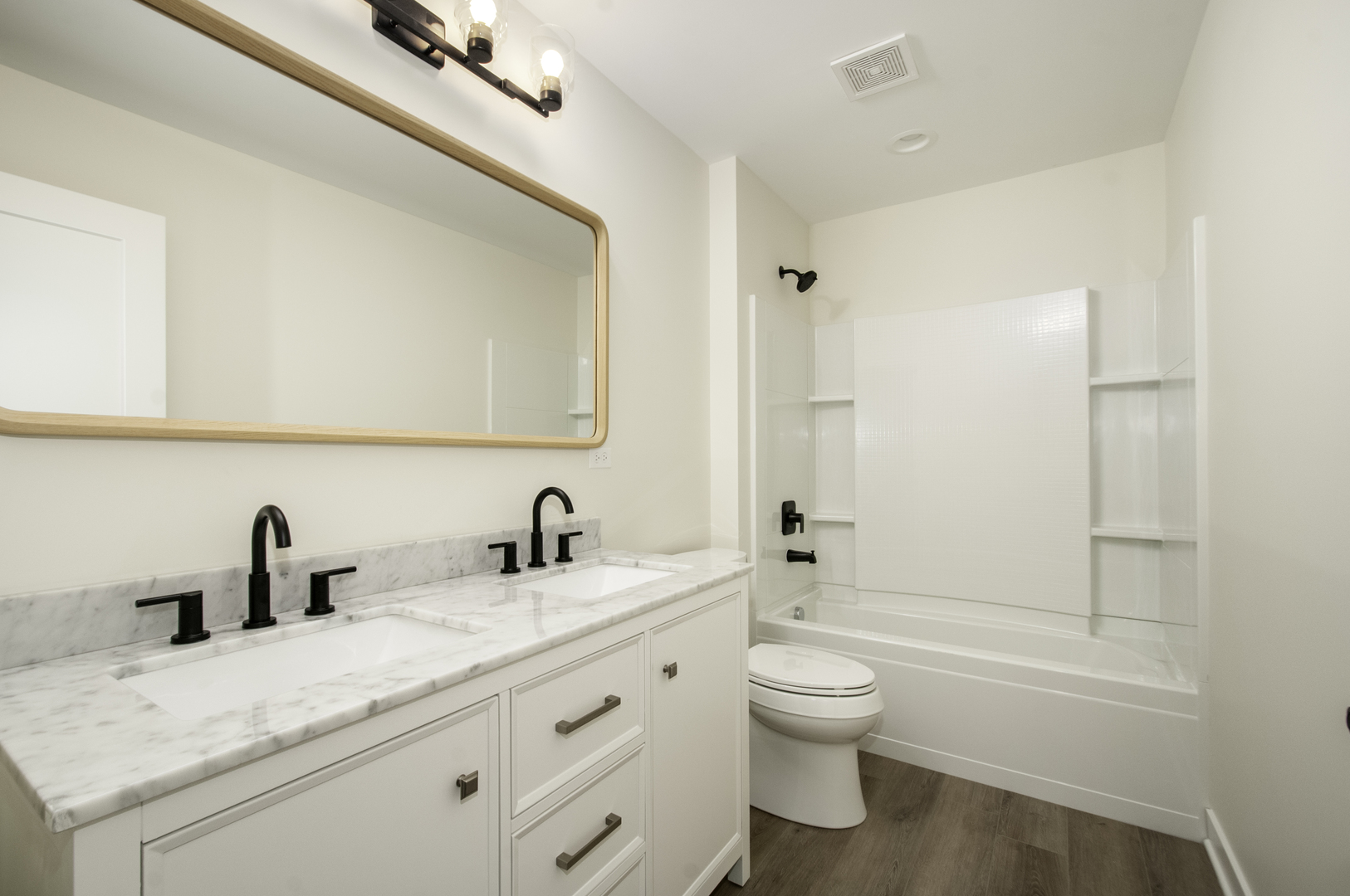 1075 Freedom Road Elburn, IL 60119 - Photo 18 of 18 a bathroom with a granite countertop sink a toilet and a bathtub