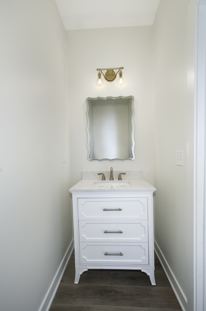 1075 Freedom Road Elburn, IL 60119 - Photo 4 of 18 a bathroom with a sink and a mirror