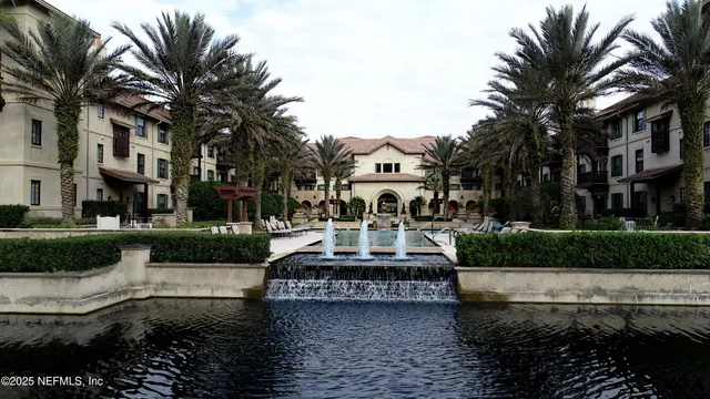 an aerial view of a house with a swimming pool outdoor seating and yard