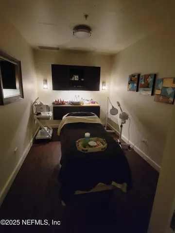 a living room with furniture and a lamp