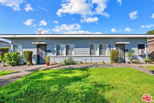 a front view of a house with a patio